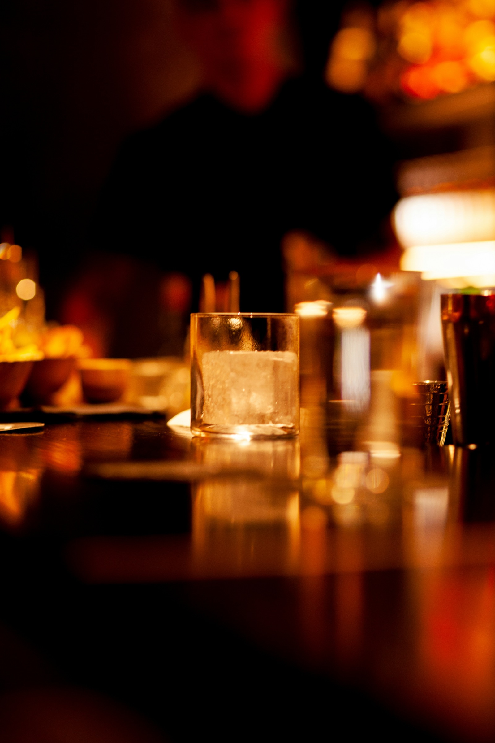 Warm, intimate atmosphere across a polished bar